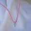 Collar Cruz Circones Plateada Cuerito Rosado